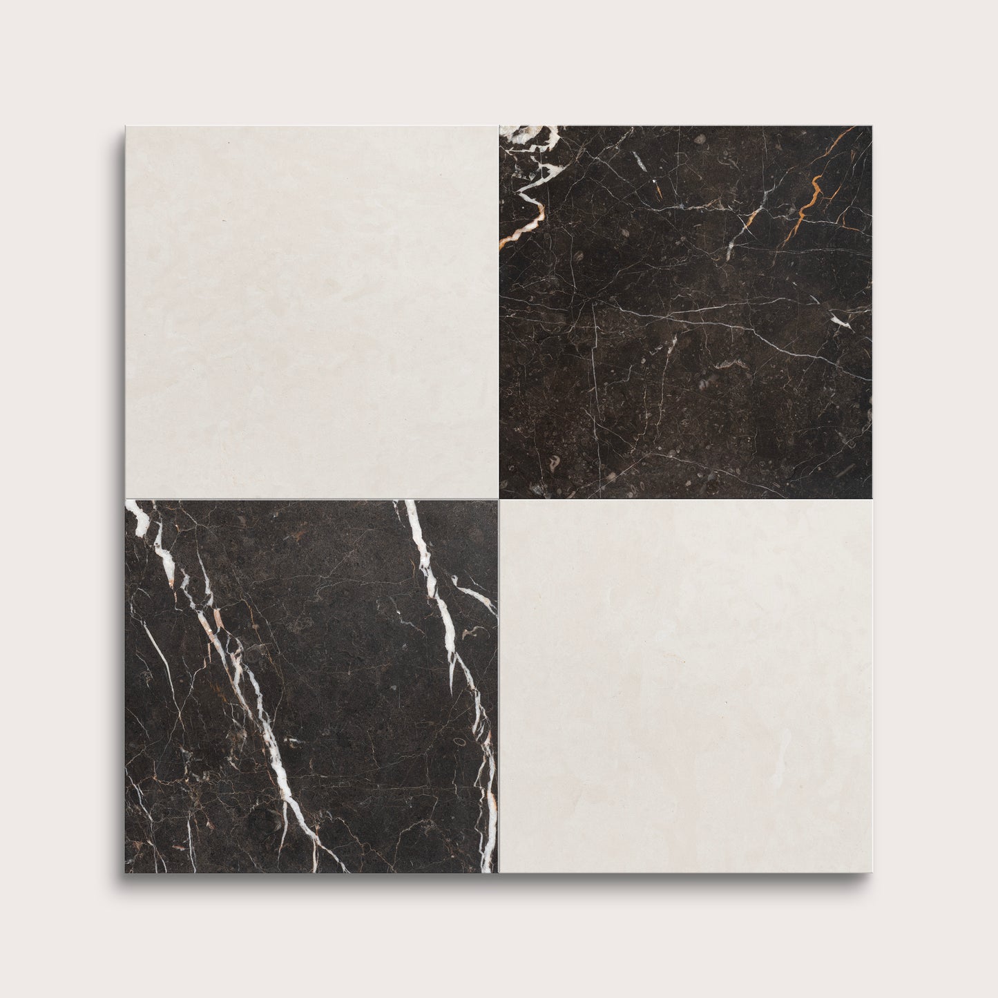 Four square tiles with black and white marble patterns on a light gray background