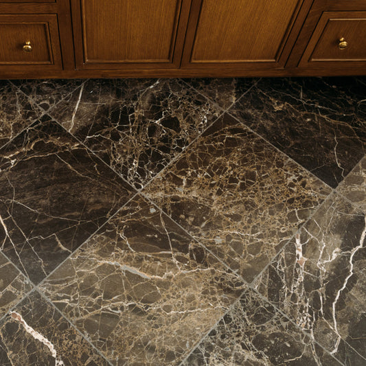 brown square marble tile installed on the floor in a bathroom