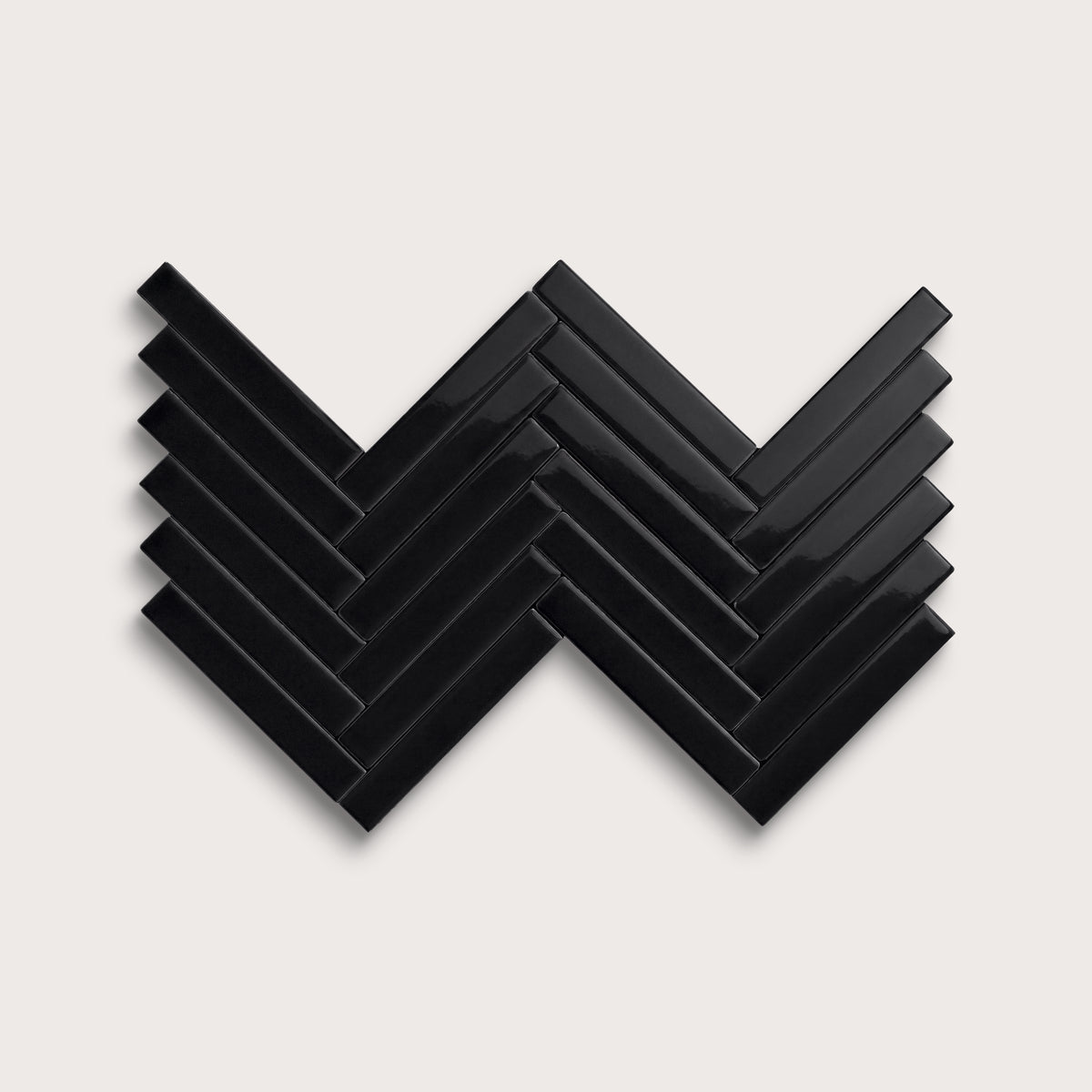 Deep Black ceramic tile, 1 by 6 inch herringbone mosaic, gloss finish