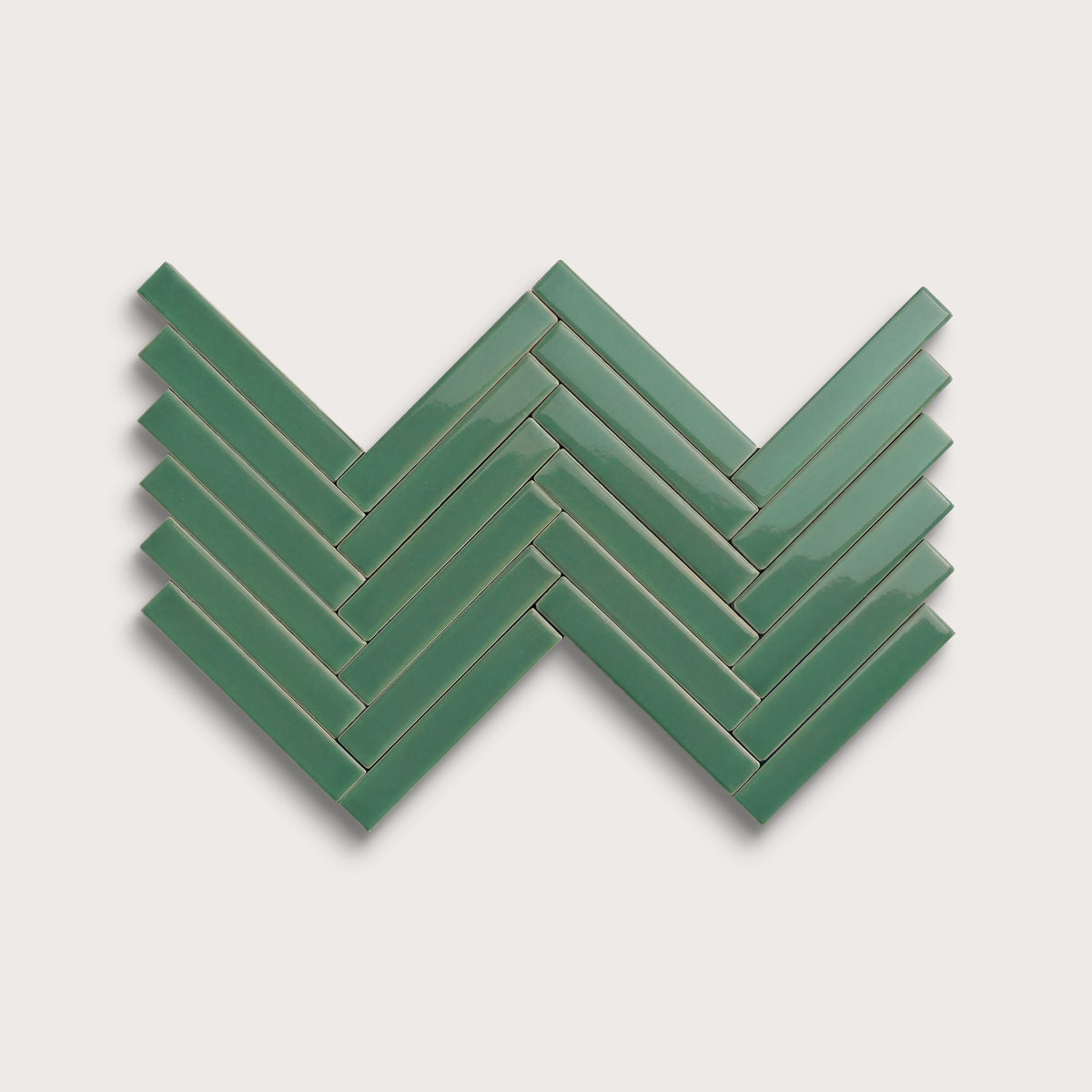 Evergreen ceramic tile, 1 by 6 inch herringbone mosaic, gloss finish