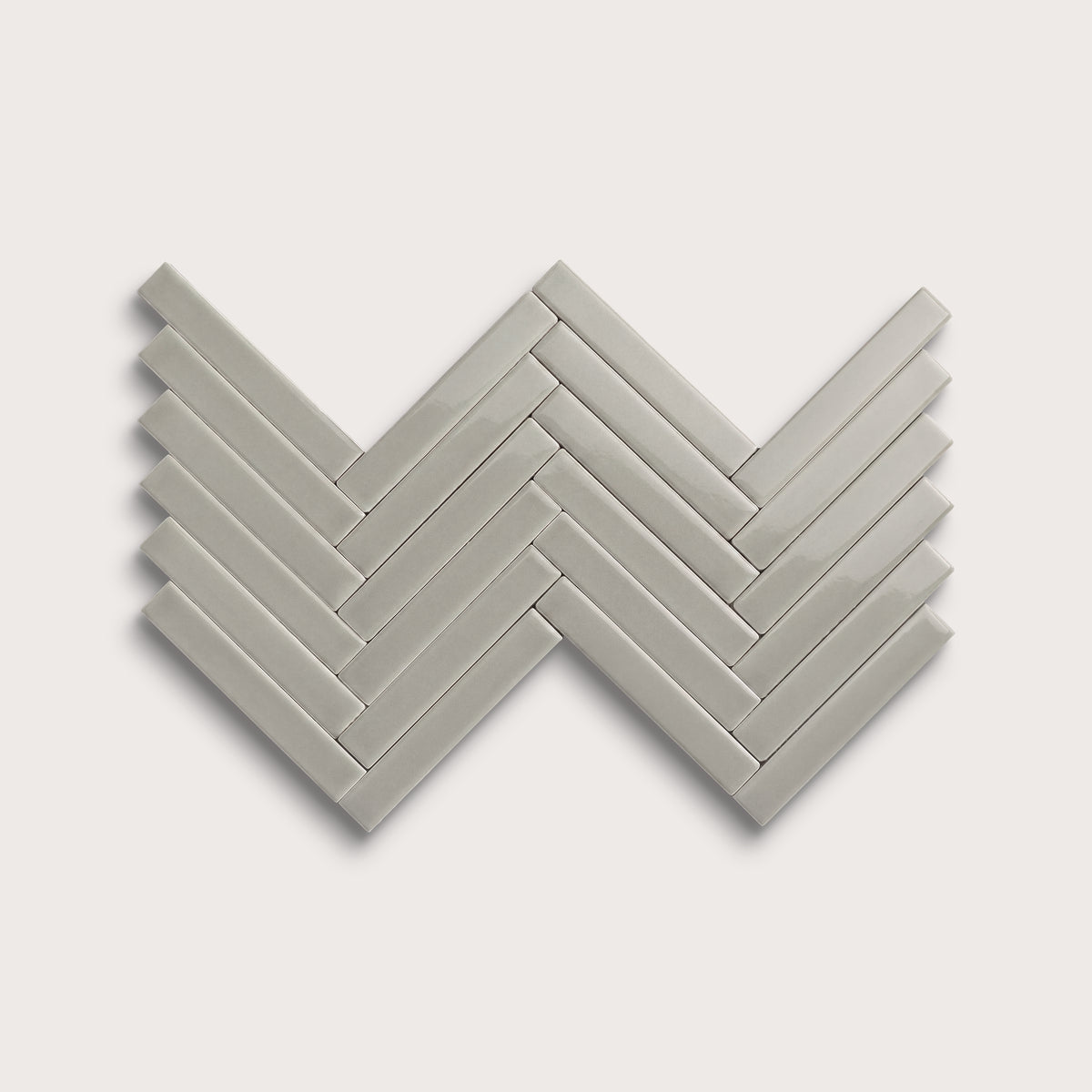 Fog ceramic tile, 1 by 6 inch herringbone mosaic, gloss finish