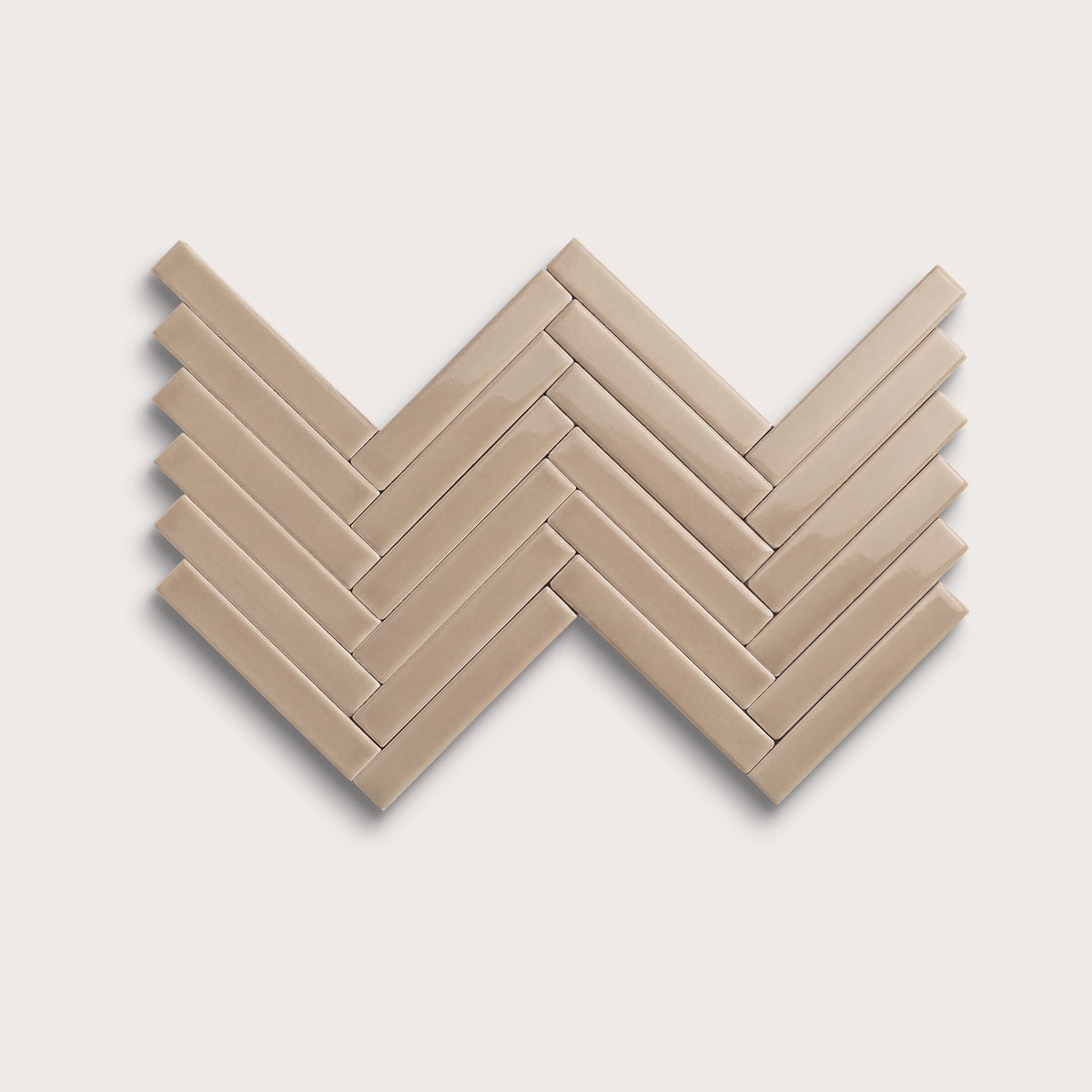 Khaki ceramic tile, 1 by 6 inch herringbone mosaic, gloss finish