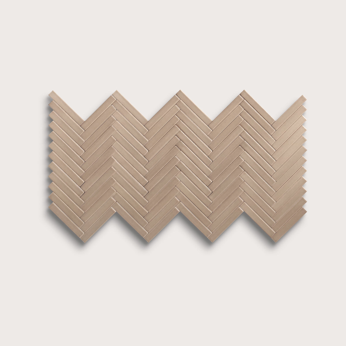Khaki ceramic tile, 1 by 6 inch herringbone mosaic, matte finish