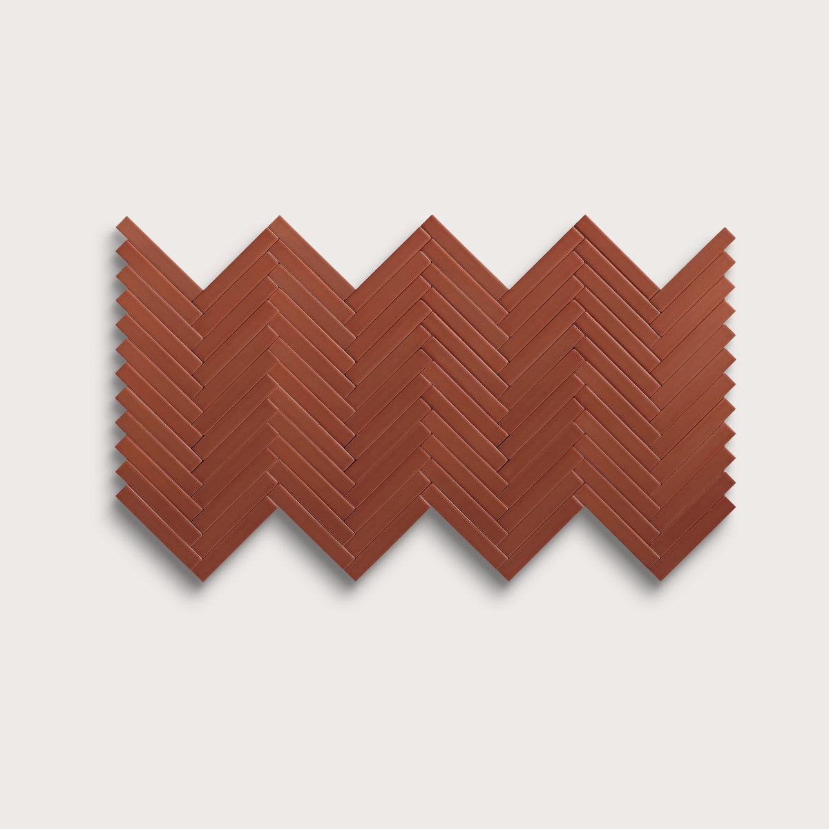 Raspberry Beret ceramic tile, 1 by 6 inch herringbone mosaic, matte finish
