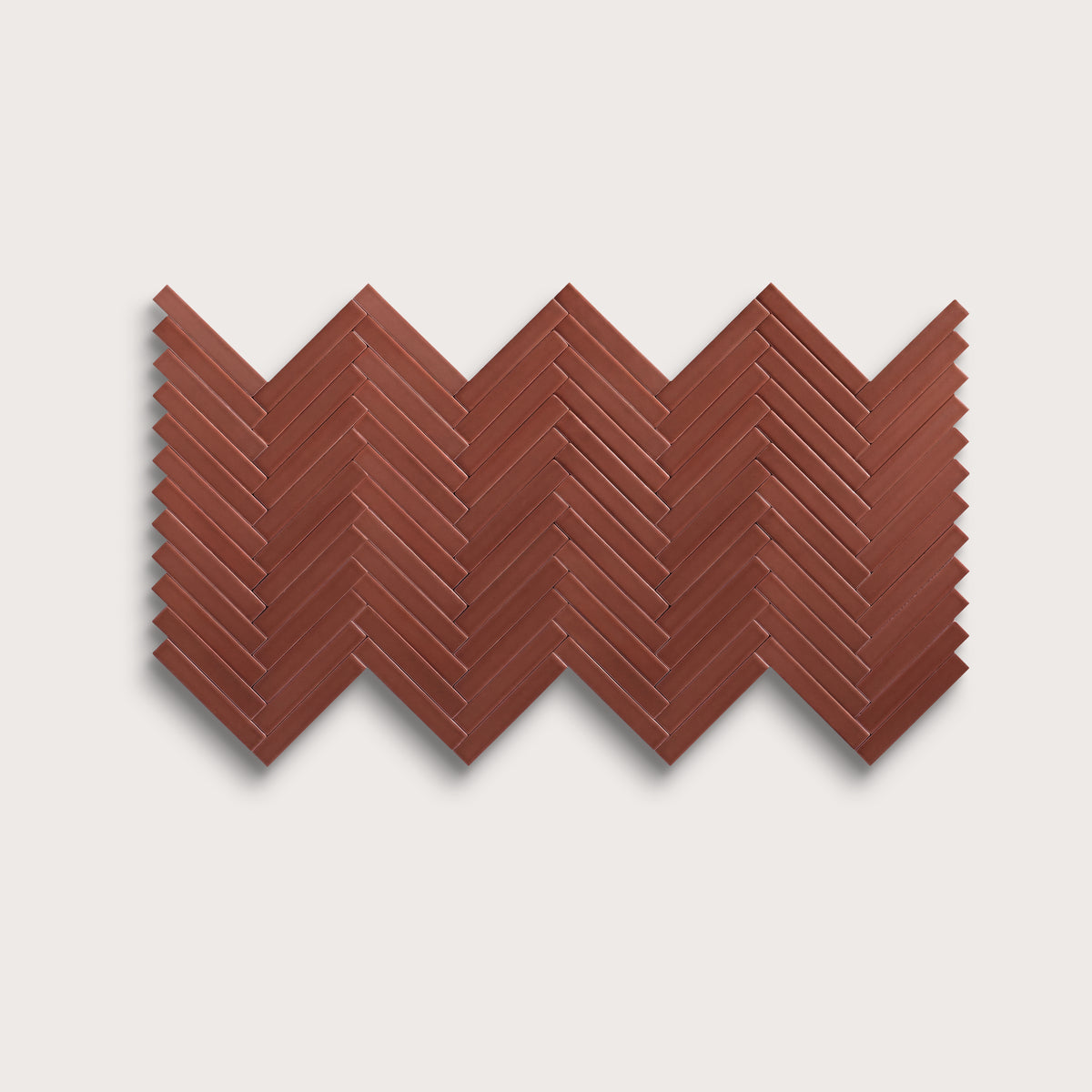 Spice ceramic tile, 1 by 6 inch herringbone mosaic, matte finish