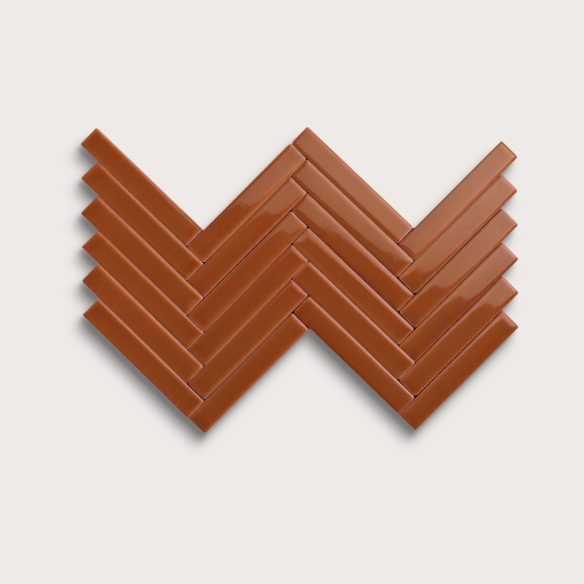 Saddle ceramic tile, 1 by 6 inch herringbone mosaic, gloss finish