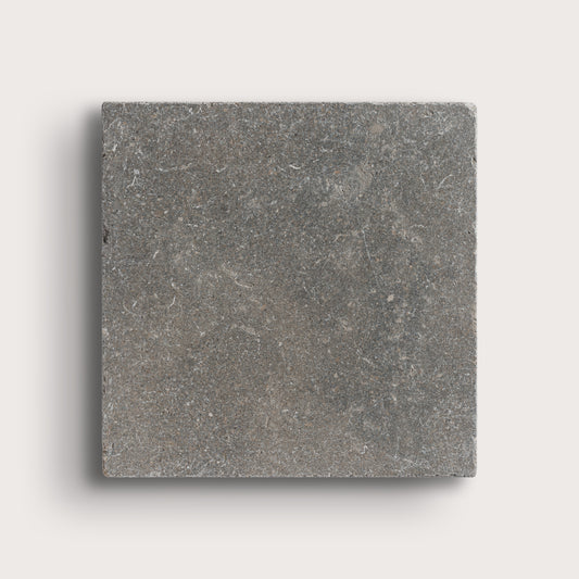 grey square limestone tile on light grey background