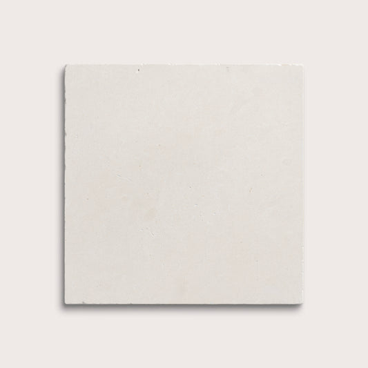 square tile with a white limestone pattern on a white background