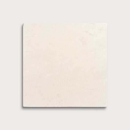 square tile with a beige limestone pattern on a white background