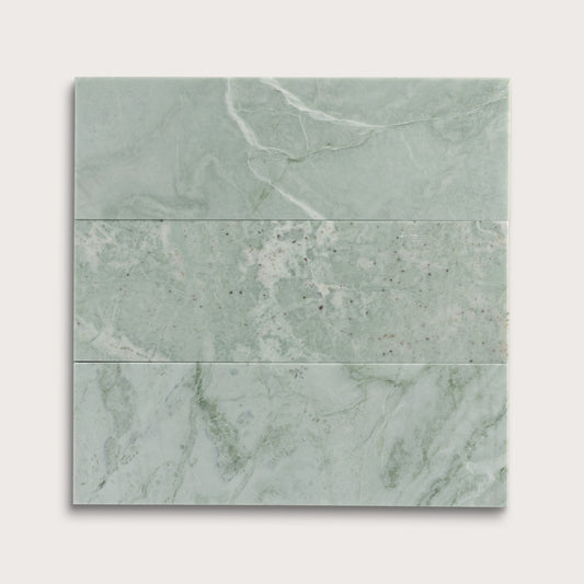 Set of green marble tiles on a white background