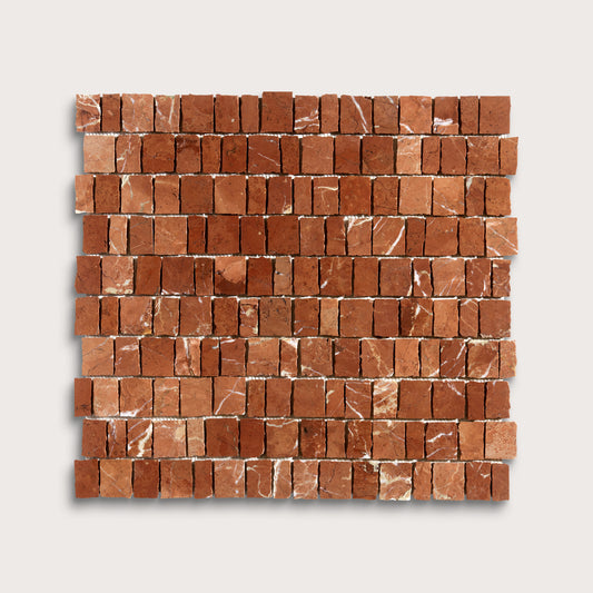 A square sample of reddish-brown marble rectangular mosaic tiles with natural white veining, arranged in horizontal rows on a light gray background.