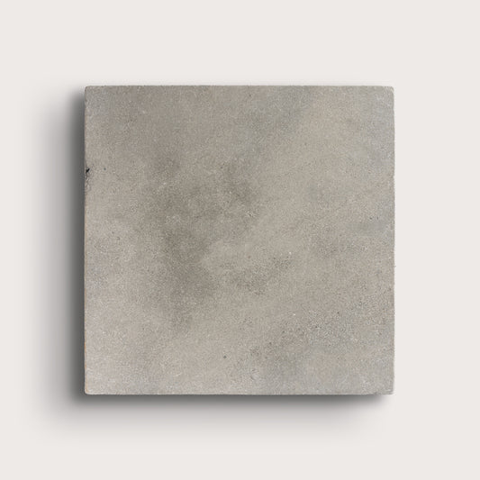 grey square limestone tiles on a light grey background