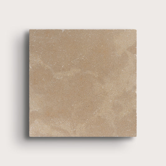 beige limestone square tile on light grey background