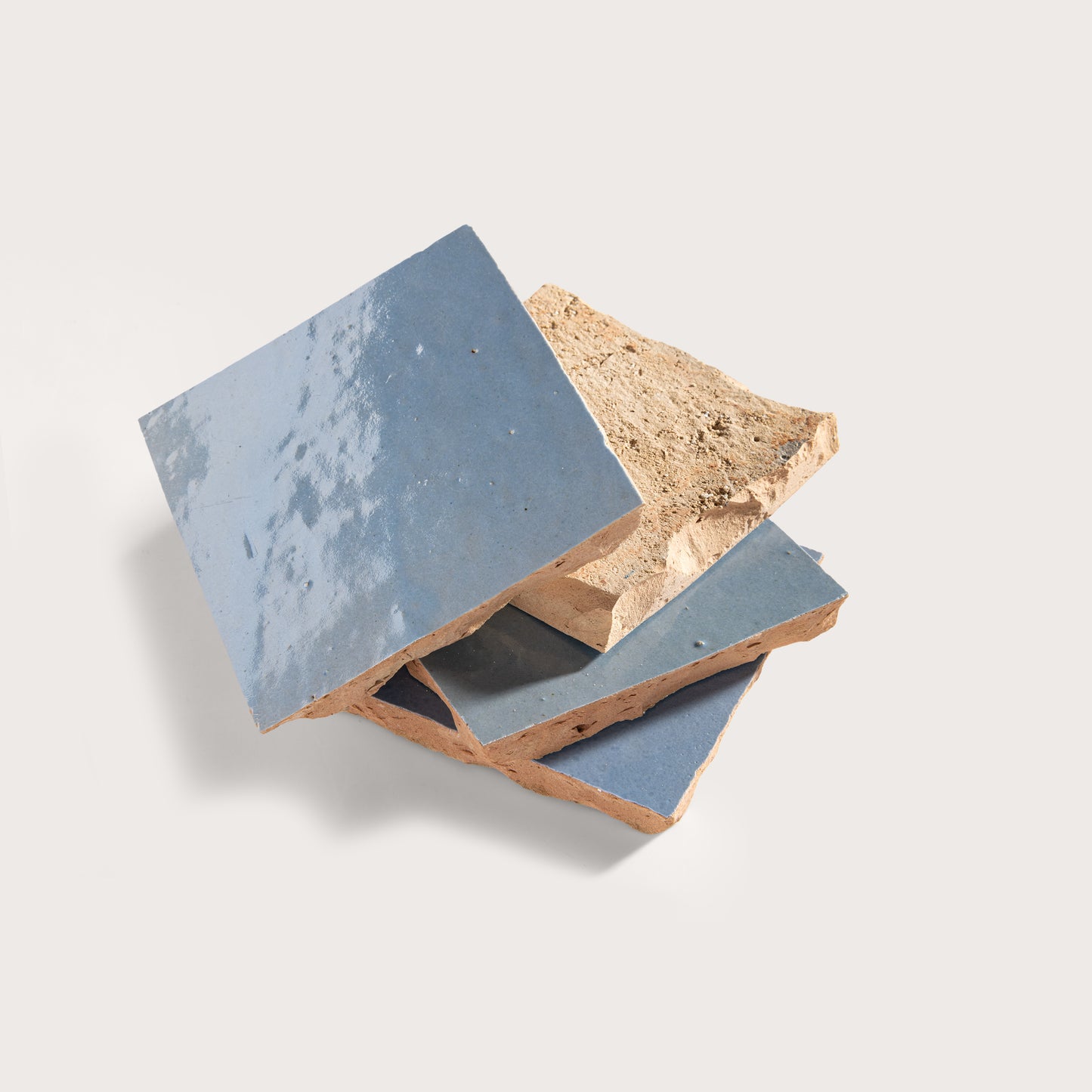 zellige tiles with blue and beige finishes on a light gray background