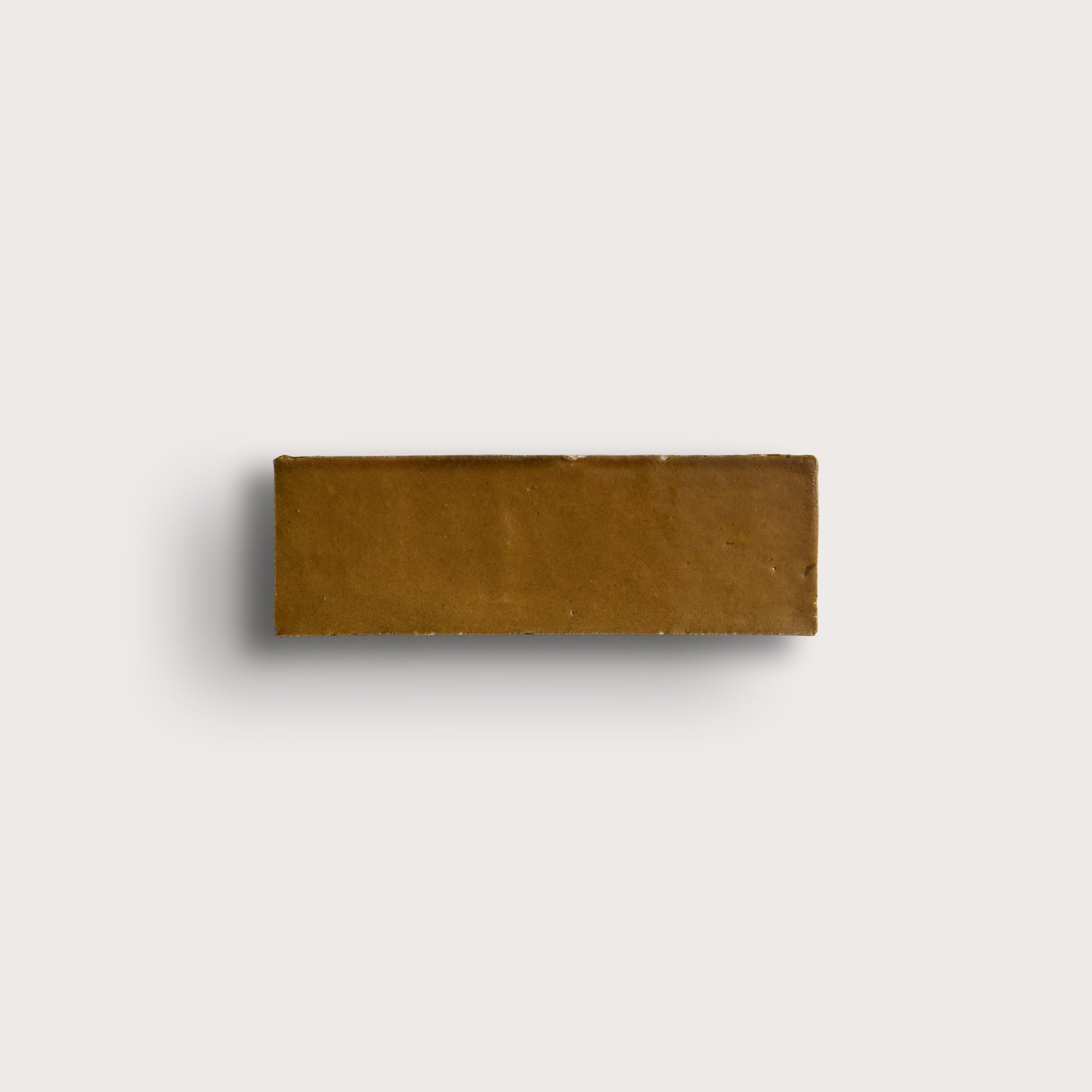 brown rectangle zellige tile on light gray background