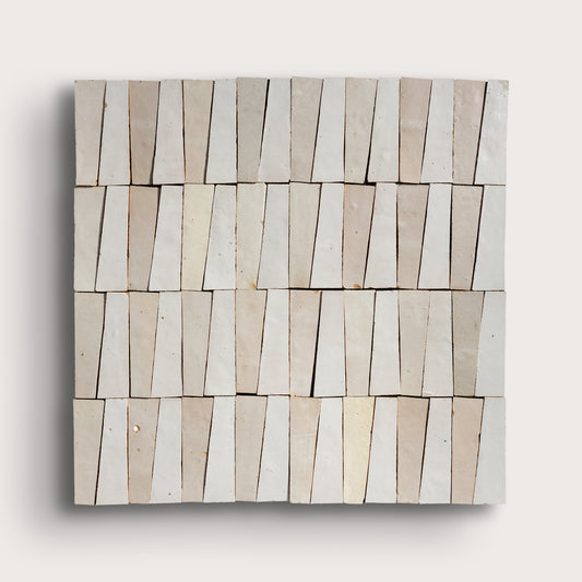 white trapezoid zellige tile on a light gray background