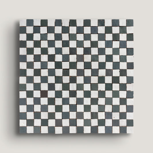 white and grey small square checkerboard zellige tile on a light grey background