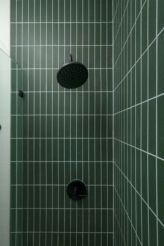 green rectangle ceramic tile in shower