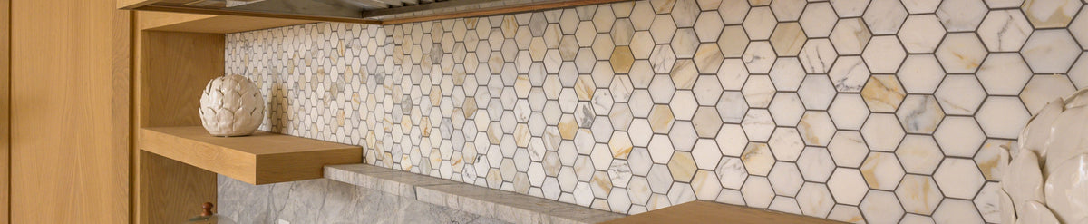 calacatta gold hexagon marble tile installed in kitchen backsplash