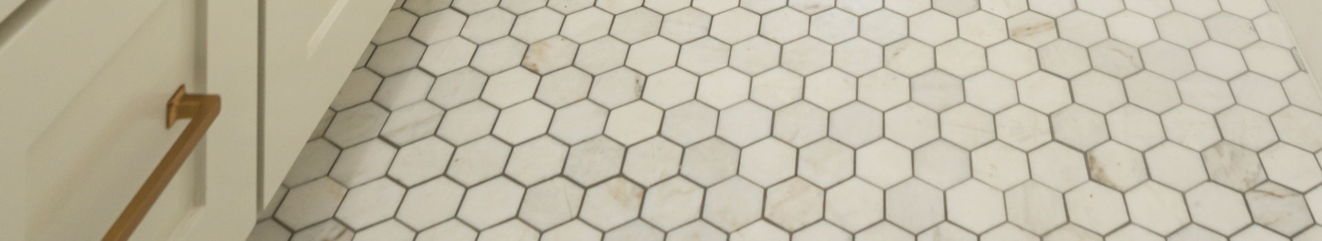 Calacatta Gold Marble hexagon tile installed on bathroom floor