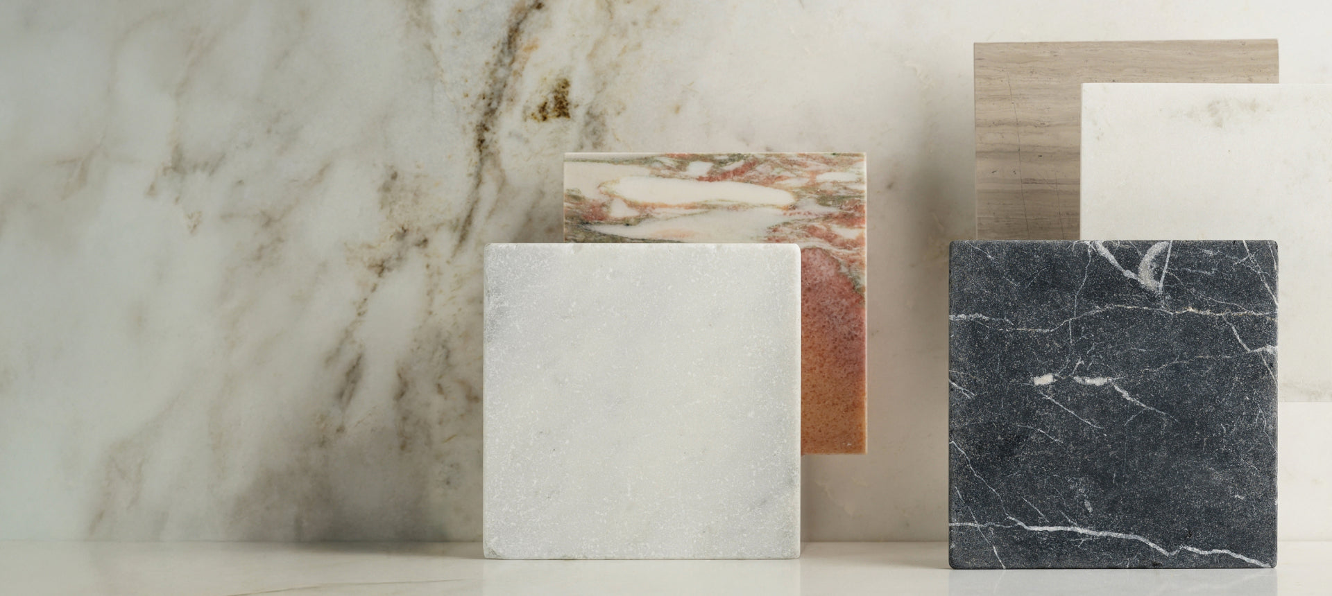 different marble variations in white, black, and pink hues