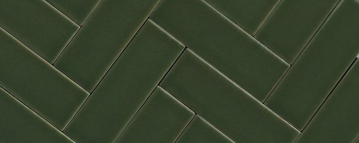green rectangle ceramic tile in herringbone pattern