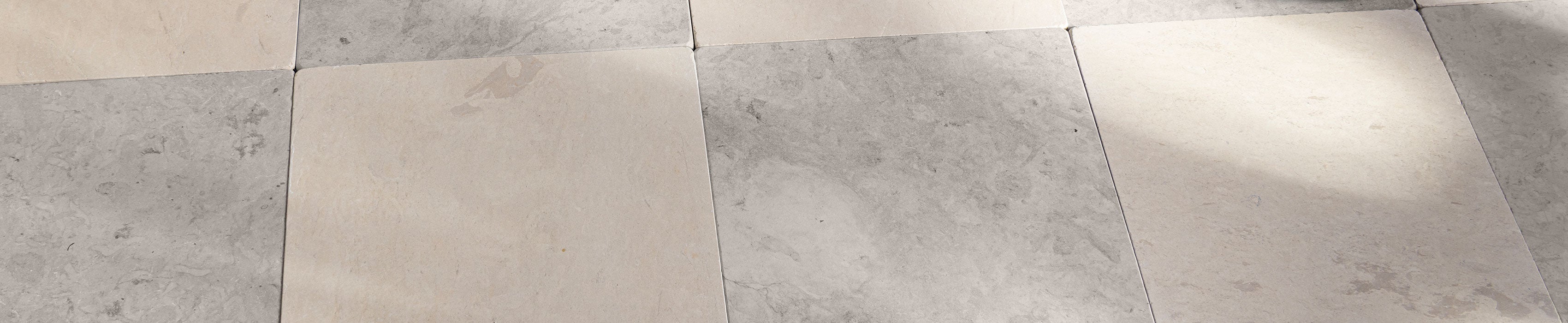 beige and grey limestone checkerboard flooring