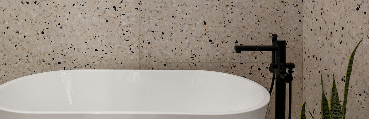 terrazzo tile as wall tile in bathroom in front of bathtub