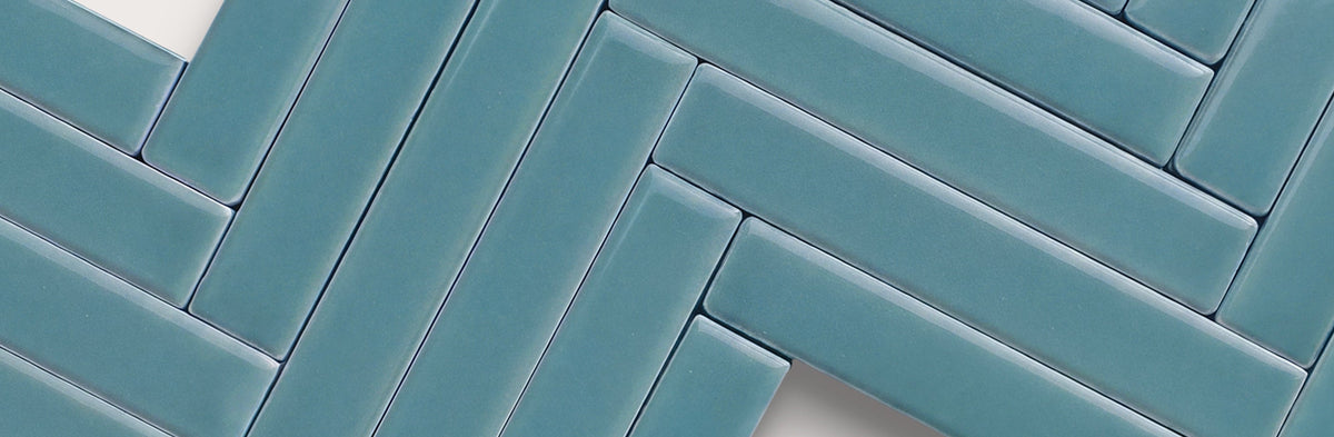 blue ceramic tile in herringbone pattern