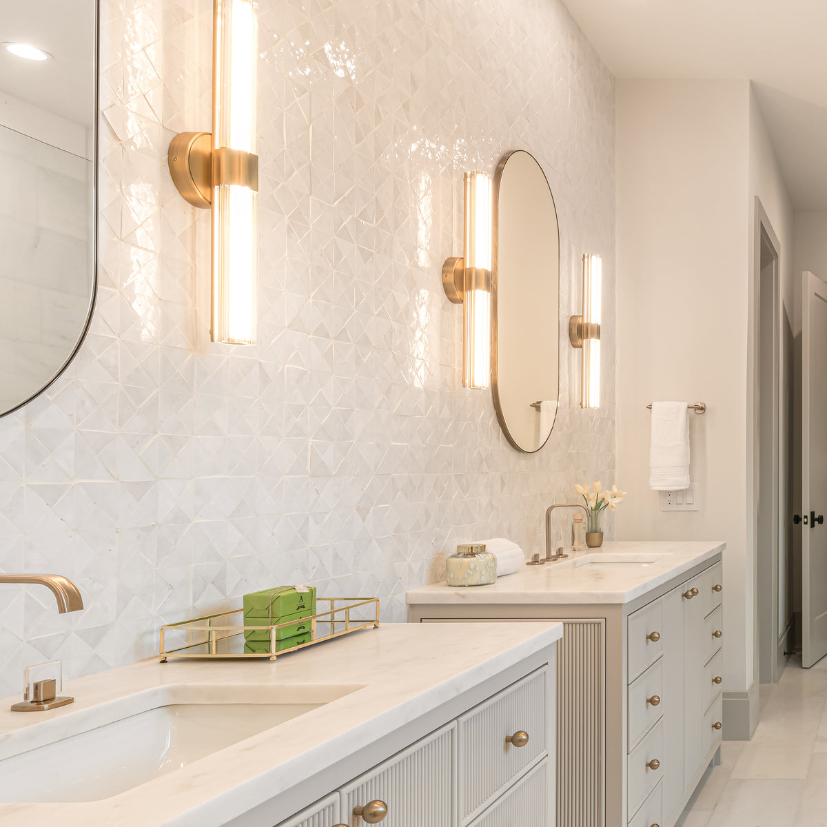 white triangle mosaic zellige tile installed as backsplash in bathroom