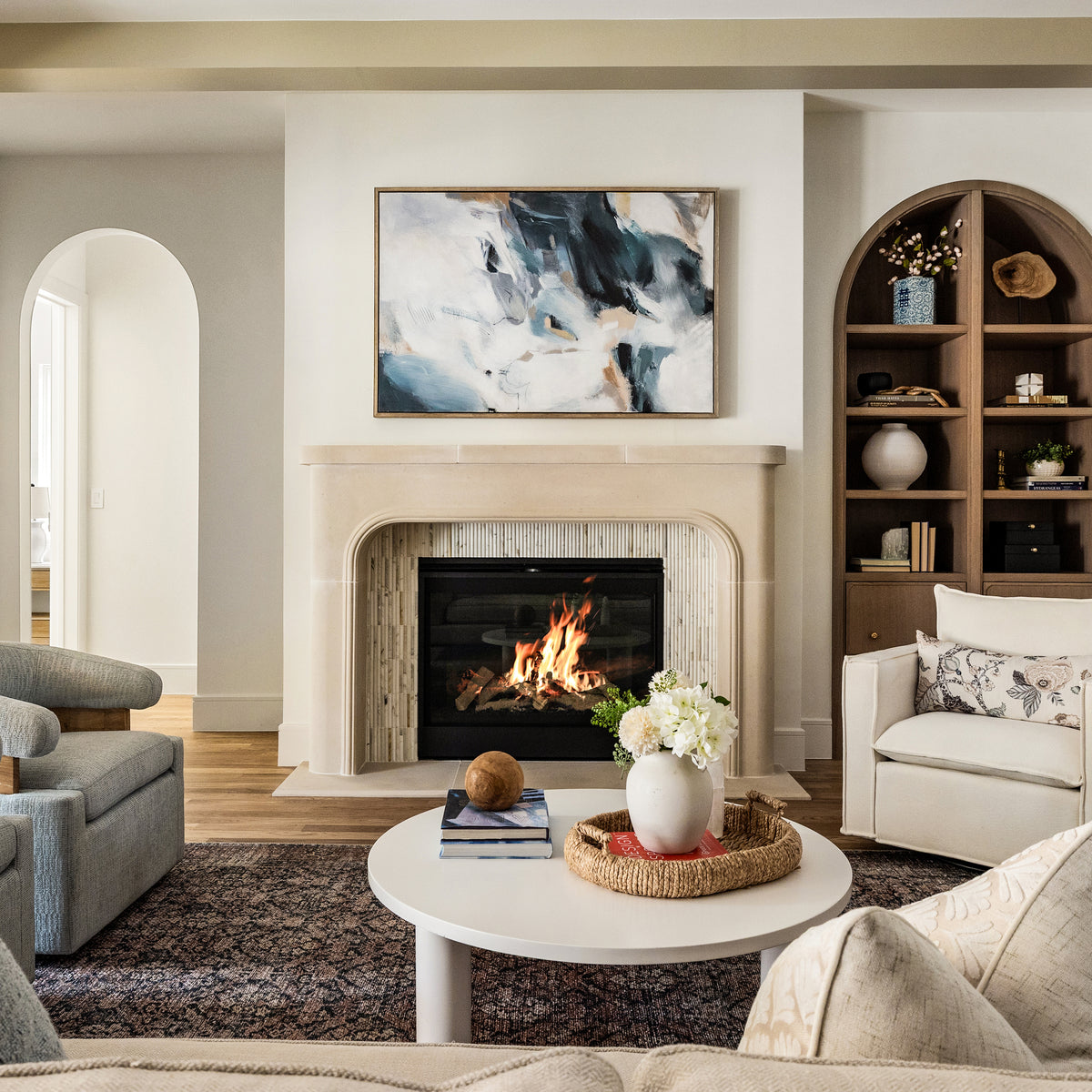 calacatta gold pencil mosaic marble tile on fireplace in living room
