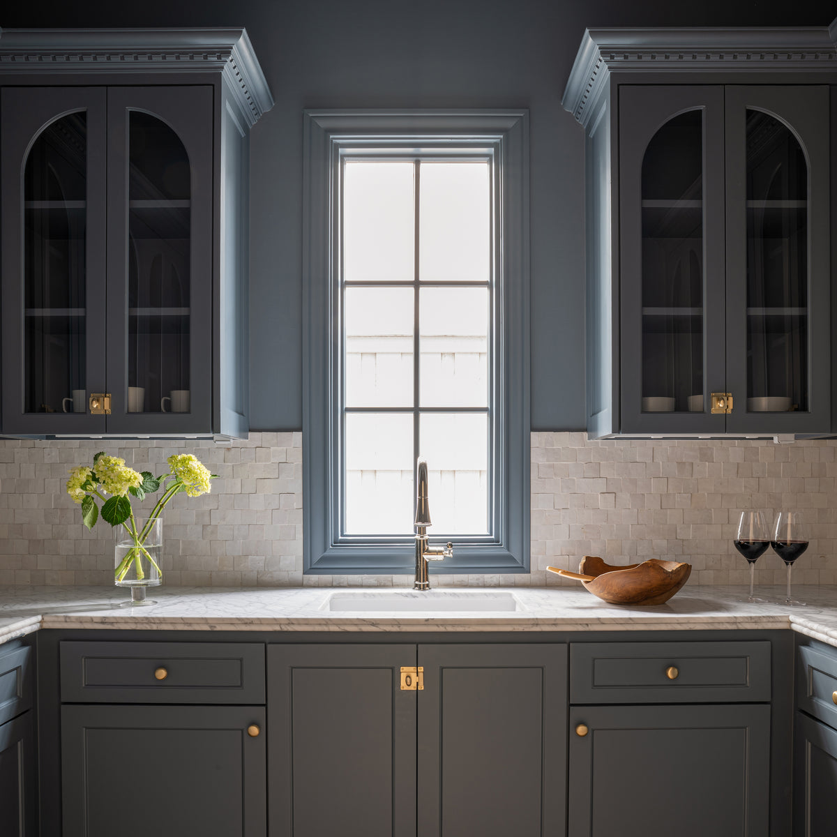 white zellige mosaic tile installed as backsplash in kitchen