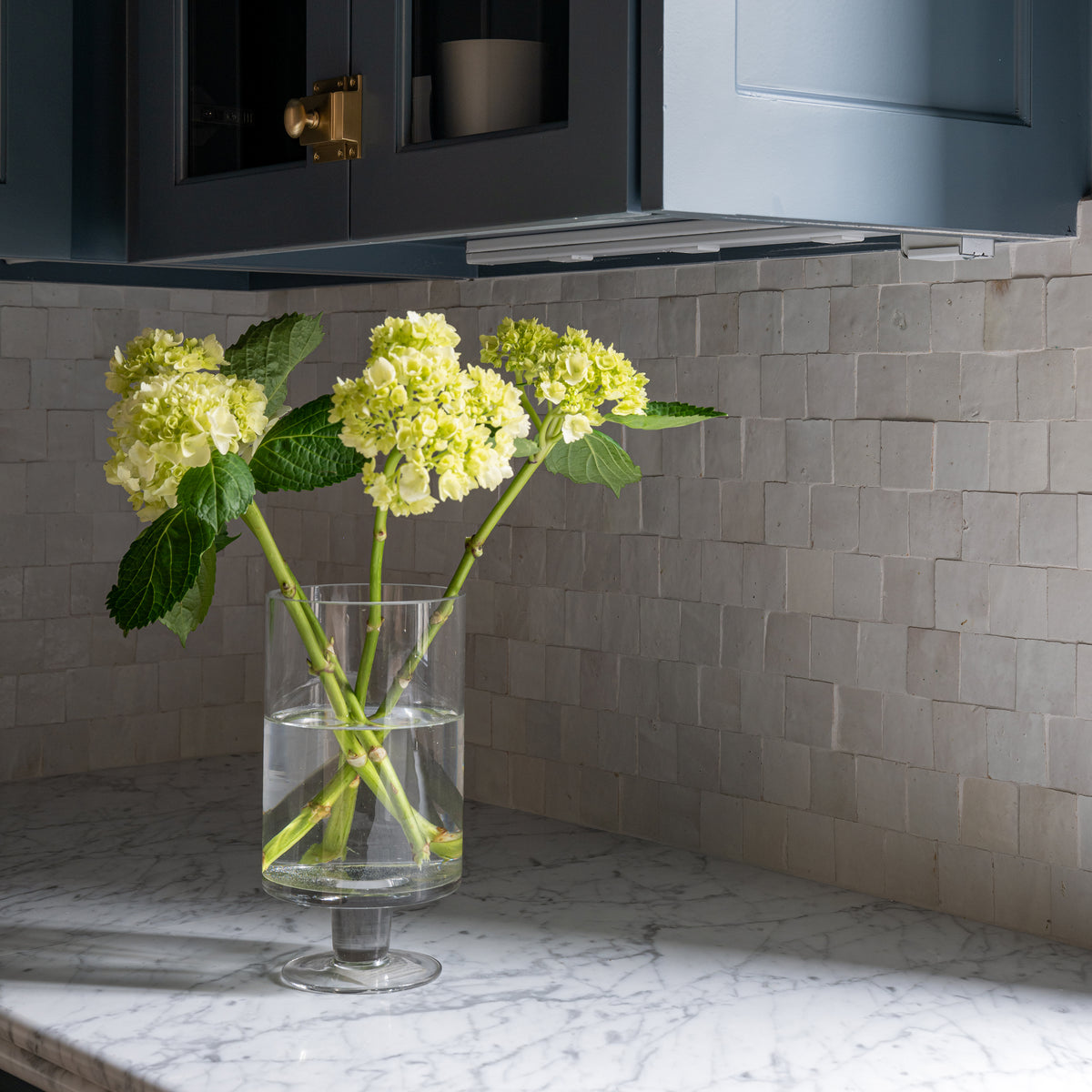white zellige mosaic tile installed as backsplash in kitchen