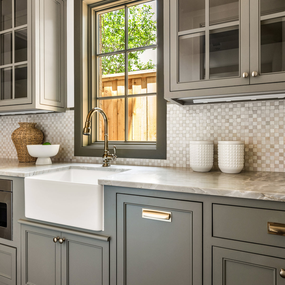 white checkerboard zellige tile installed as backsplash in kitchen