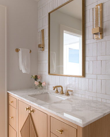 white zellige tile in a bathroom with gold accents