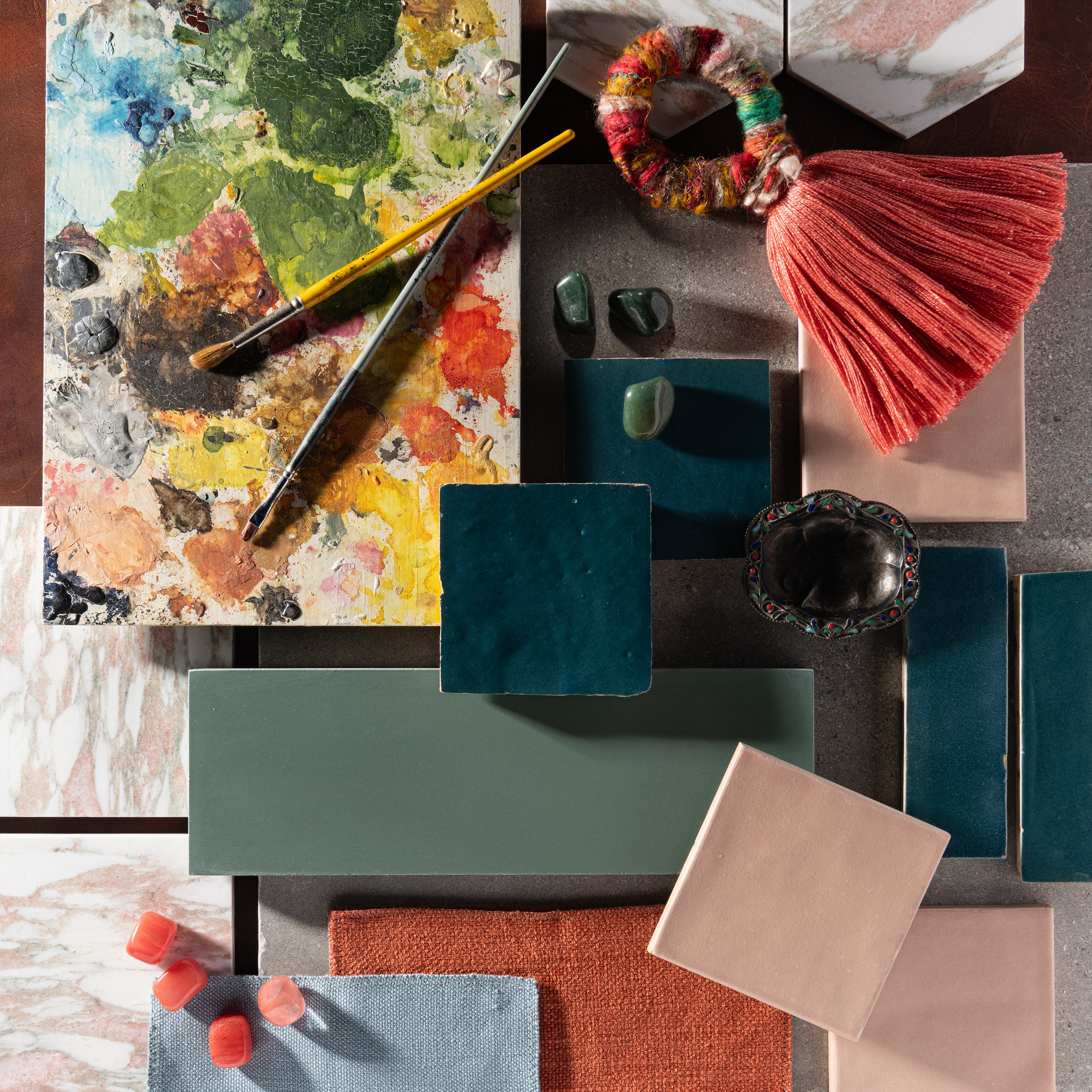 tile mood board of blue, pink, green, and grey tiles. Includes zellige, limestone, marble, ceramic and cement tiles.