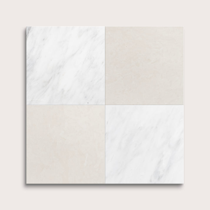 Four square tiles with marble patterns on a light gray background