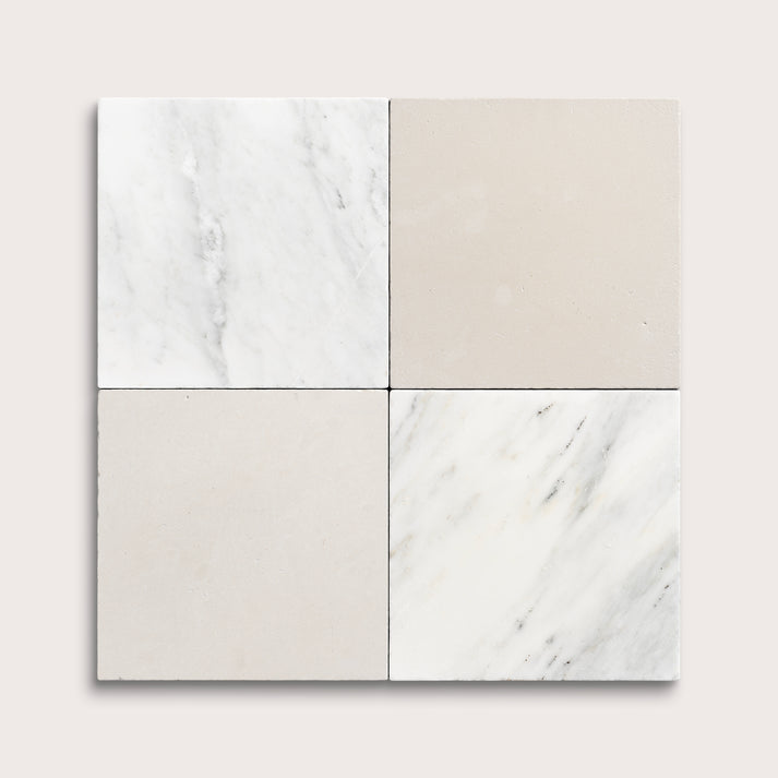 Four square tiles with marble-like patterns on a light gray background