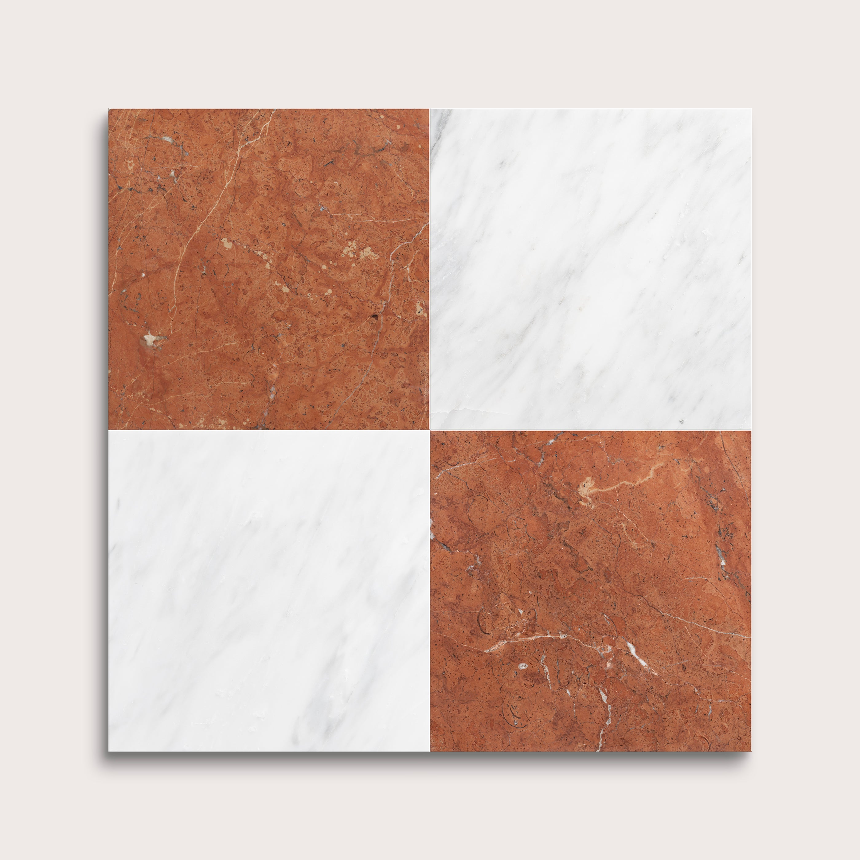 Four square tiles in brown and white on a light gray background