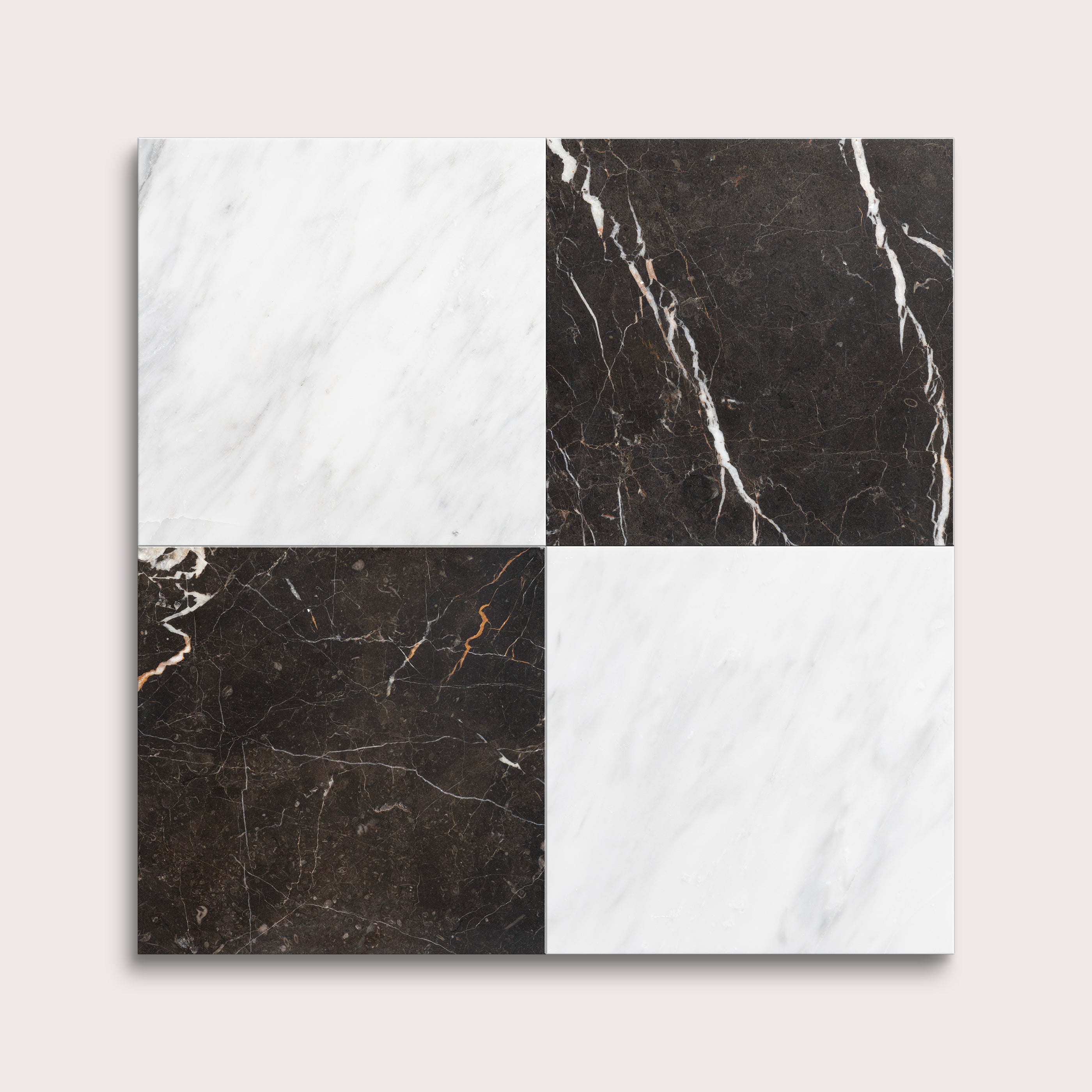 Four square tiles with black and white marble patterns on a light gray background
