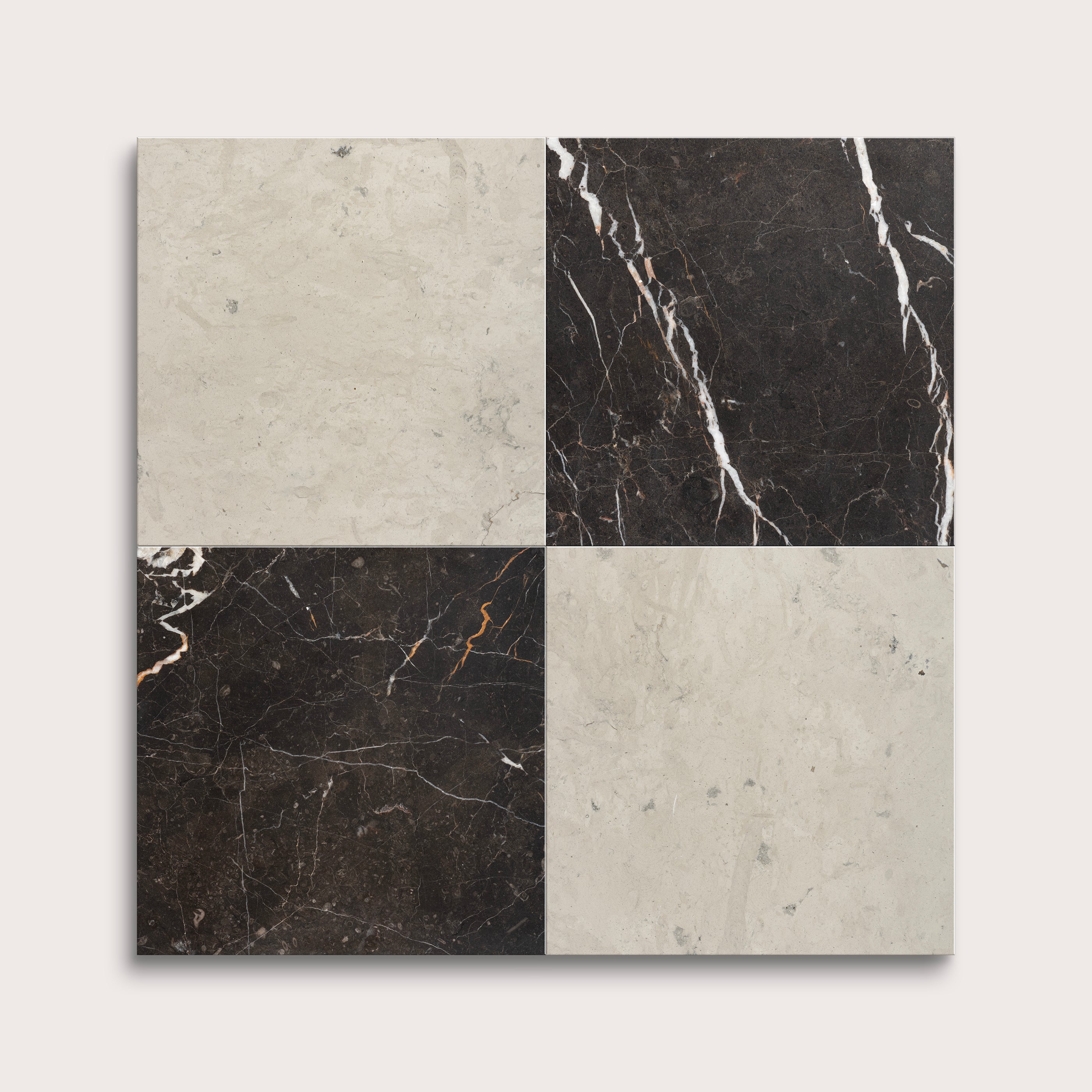 Four square tiles with different marble patterns on a light gray background
