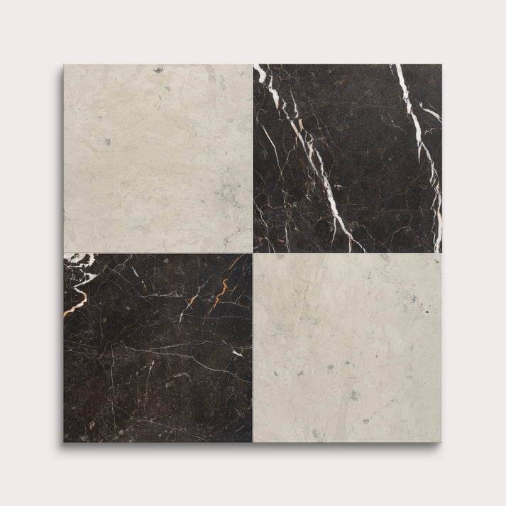 Four square tiles with different marble patterns on a light gray background