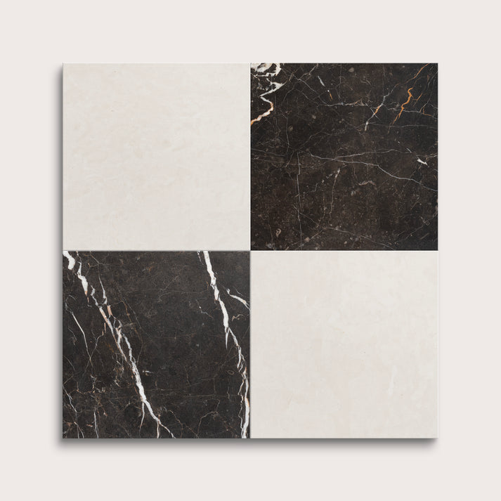 Four square tiles with black and white marble patterns on a light gray background