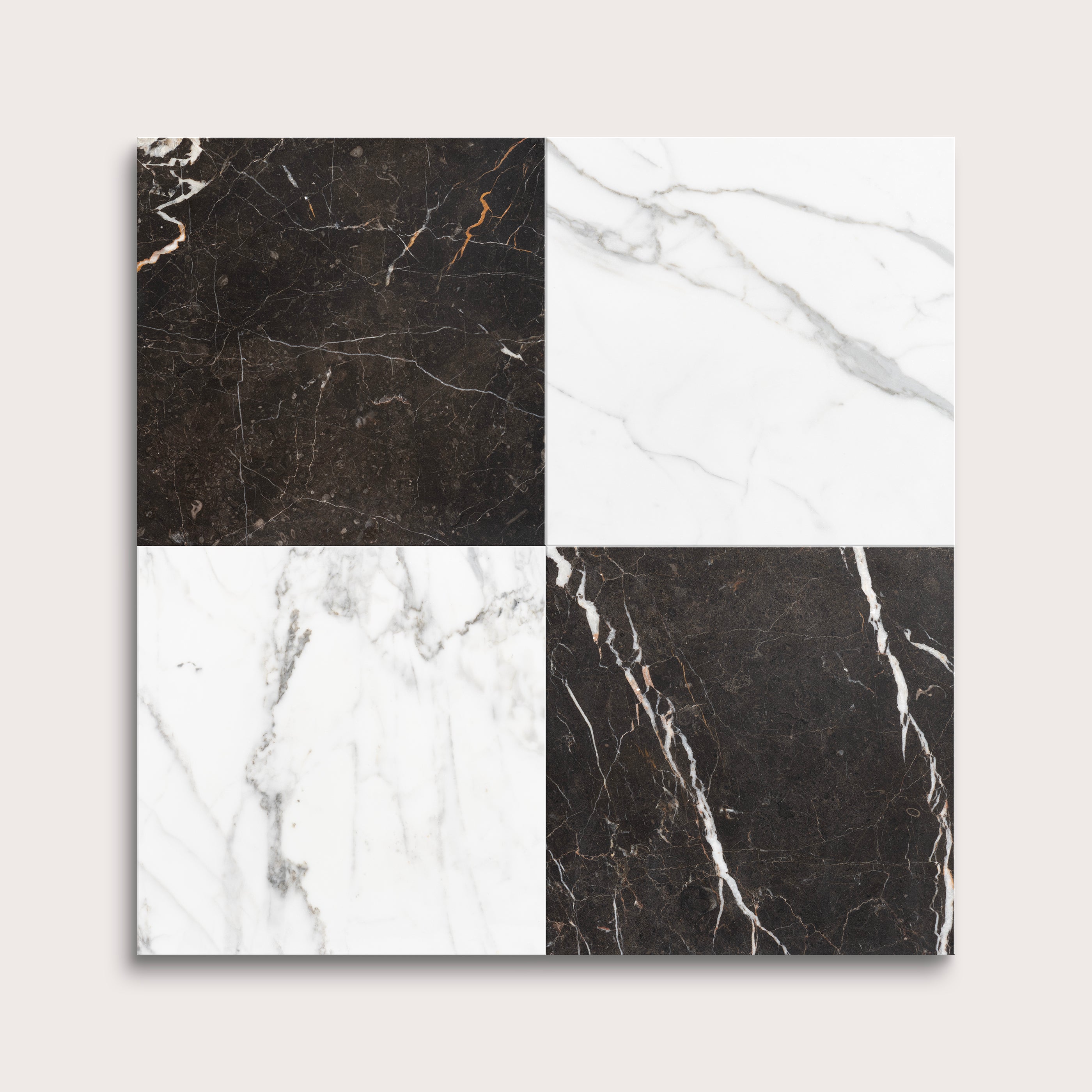 Four square tiles with different marble patterns on a light gray background