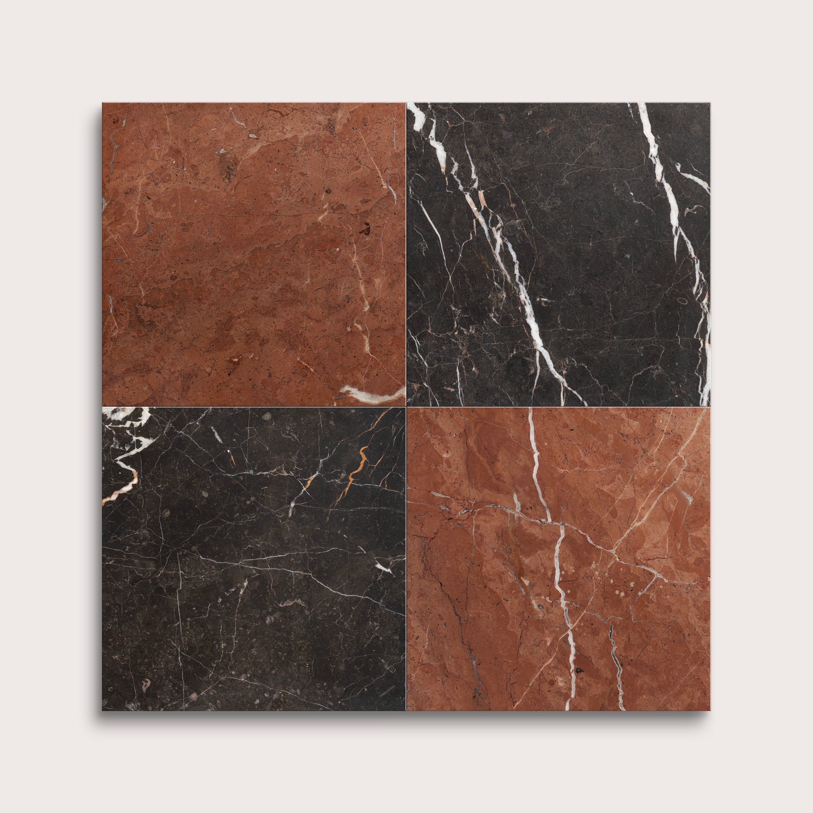 Four square tiles with black, brown, and red marbled patterns on a white background