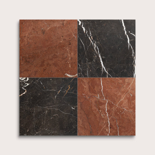 Four square tiles with black, brown, and red marbled patterns on a white background
