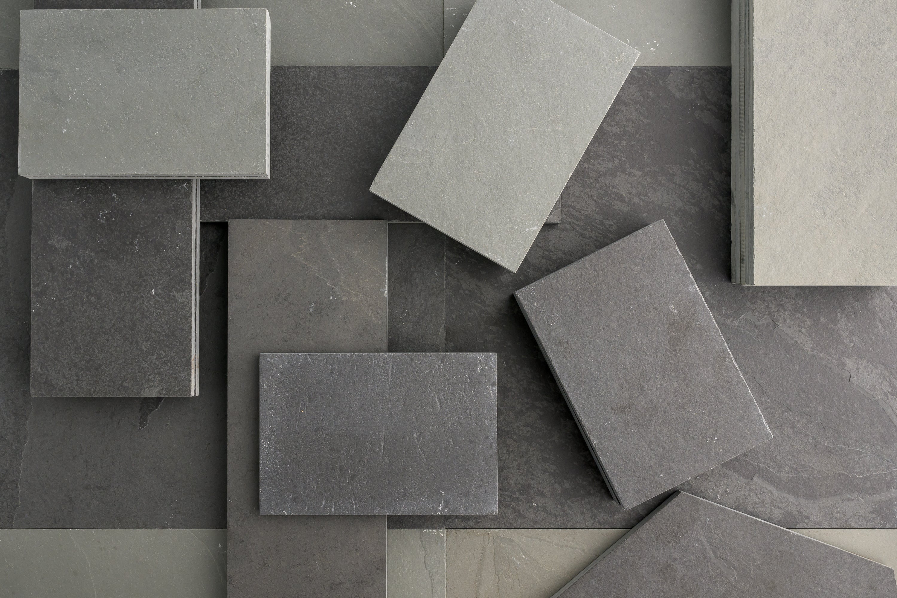 stone and ceramic tiles in various shades, perfect for flooring and wall designs in kitchens and bathrooms, available now at our tile store