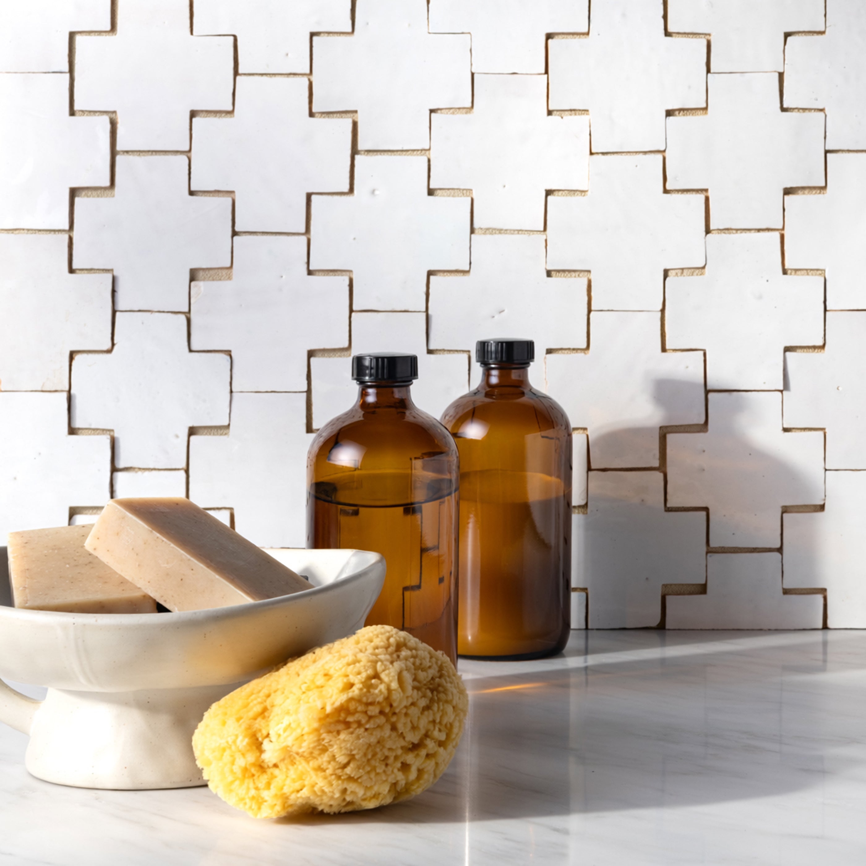 bright white cross zellige tile backsplash in kitchen with bowl and hand soap styled in front