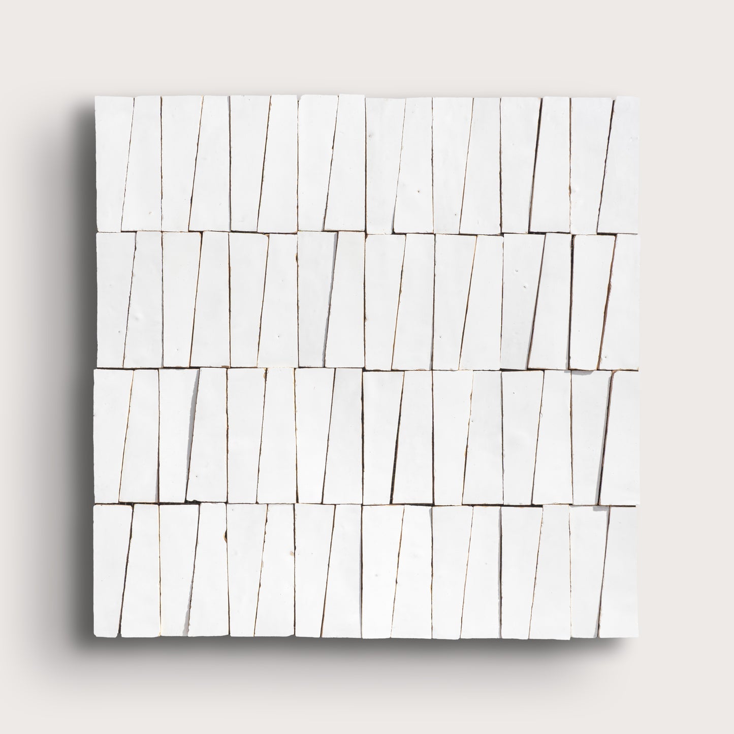 white zellige trapezoid design on a light gray background