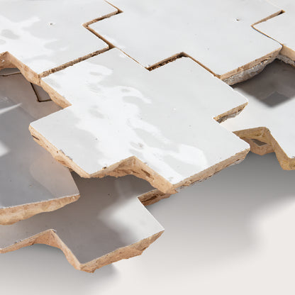 close up angle of white zellige tile in cross pattern